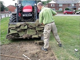 Removing turf to prepare for reseeding with a wild flower mix at Bolton Brickyards green space. NIA